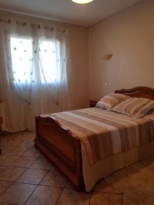 a bedroom with a large bed and a window at Villa seynoise in La Seyne-sur-Mer