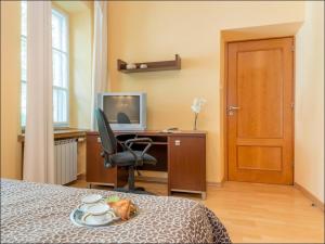 Televízia a/alebo spoločenská miestnosť v ubytovaní P&O Apartments Piwna