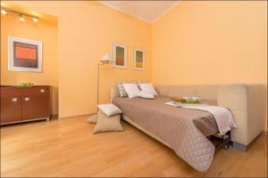 מיטה או מיטות בחדר ב-P&O Apartments Piwna
