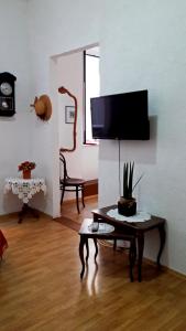 a living room with a tv and a table at Apartment Mimmy in Dubrovnik