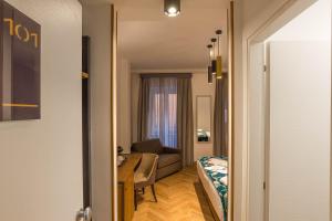Postel nebo postele na pokoji v ubytování Navona Essence Hotel