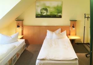 Ένα ή περισσότερα κρεβάτια σε δωμάτιο στο Hotel Lindenthal