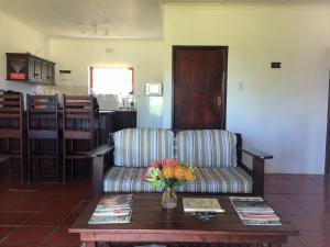 a living room with a couch and a coffee table at Fraaigelegen Farm - Home of ADHARA EVOO in Tulbagh +74 photos