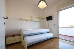Postel nebo postele na pokoji v ubytování L'ippocampo Guest House