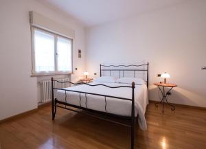Postel nebo postele na pokoji v ubytování L'ippocampo Guest House