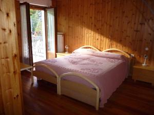 Postel nebo postele na pokoji v ubytování Hotel Fior di Roccia