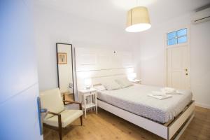 Posteľ alebo postele v izbe v ubytovaní Apartamentos Catedral
