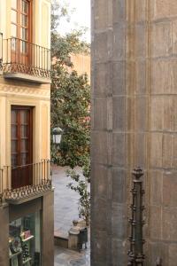 a corner of a building next to a building at Alcaiceria in Granada