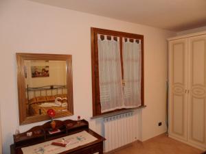 A bed or beds in a room at Podere San Pierino