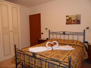 A bed or beds in a room at Podere San Pierino
