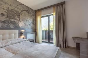 Postel nebo postele na pokoji v ubytování Hotel Regent's