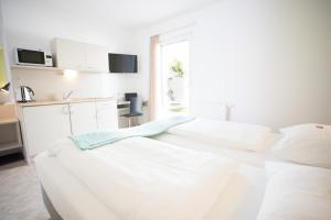 Posteľ alebo postele v izbe v ubytovaní motel22 Parkplatz inklusive