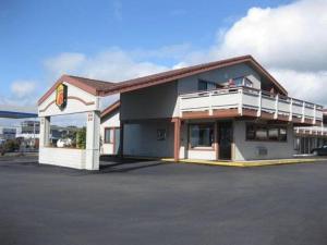 a building with a balcony on top of it at Super 8 by Wyndham Fort Bragg in Fort Bragg