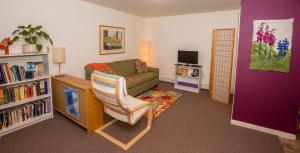 a living room with a couch and a chair at Gardenside Bed and Breakfast in Anchorage