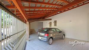 a car parked in the garage of a house at Casa Temporada Silvana in Olímpia