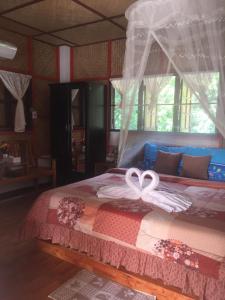 Postel nebo postele na pokoji v ubytování Yayee Homestay