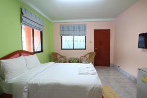Postel nebo postele na pokoji v ubytování Baan Boa Guest House