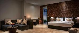 A bed or beds in a room at Kelapa Retreat & Spa