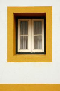 a window on the side of a building at Monte da Amoreira in Elvas