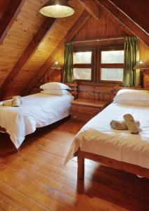 a bedroom with two beds in a attic at First Group Sodwana Bay Lodge Self Catering in Sodwana Bay