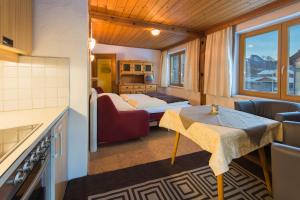 a room with a bed and a table in a room at Apartement Haus Johanna in Kitzbühel