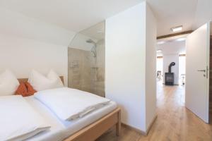 Ліжко або ліжка в номері Apartment Pötzelberghof
