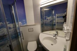 
Ein Badezimmer in der Unterkunft Hotel Sonnekalb
