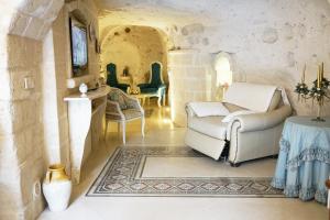 a living room with a couch and a table at Angolo Fiorito in Matera