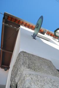 a satellite dish sitting on the side of a building at Casa Luís de Camões - Boutique & Literary House in Santar