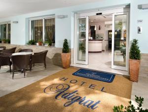 a hotel restaurant with a welcome mat on the floor at Hotel Adigrat in Riccione +121 photos