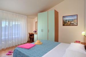 Postel nebo postele na pokoji v ubytování Hotel Capri