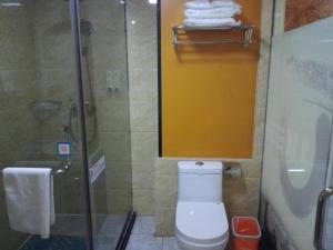 a bathroom with a shower and a toilet and a sink at Pai Hotel Nanjing Maogaoqiao Metro Station in Nanjing +16 photos