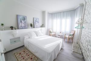 Postel nebo postele na pokoji v ubytování Gr Suites Boutique Alcazaba