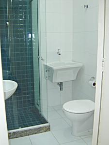 a bathroom with a shower and a toilet and a sink at Studio Copacabana in Rio de Janeiro