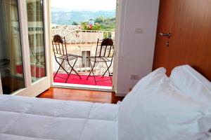 Posteľ alebo postele v izbe v ubytovaní Hotel La Dimora di Piazza Carmine