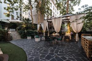 Сад в Hotel Manin