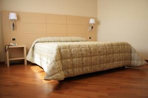 Postel nebo postele na pokoji v ubytování Hotel Ottagono