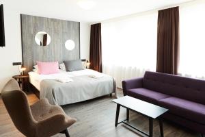 Ένα ή περισσότερα κρεβάτια σε δωμάτιο στο Fosshotel Husavik