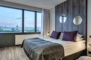 Ένα ή περισσότερα κρεβάτια σε δωμάτιο στο Fosshotel Husavik