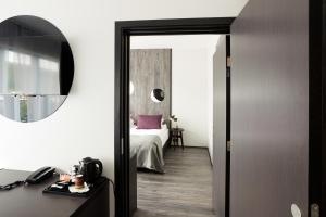 Ένα ή περισσότερα κρεβάτια σε δωμάτιο στο Fosshotel Husavik