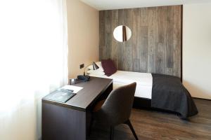Ένα ή περισσότερα κρεβάτια σε δωμάτιο στο Fosshotel Husavik