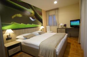 Postel nebo postele na pokoji v ubytování Hotel Calypso
