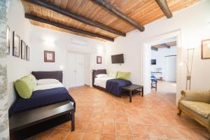 Posteľ alebo postele v izbe v ubytovaní Palazzo Marigliano - Rooms & Suites