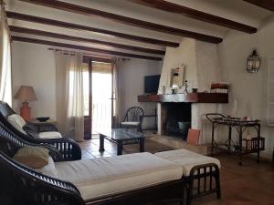 a living room with a couch and a fireplace at Moraira Amazing Rustic Village in Moraira