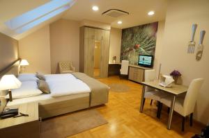 TV a/nebo společenská místnost v ubytování Hotel Calypso
