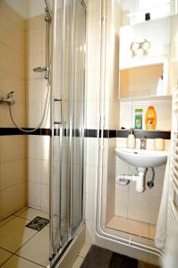a bathroom with a shower and a sink at Apartments Ostrava Vítkovice in Ostrava