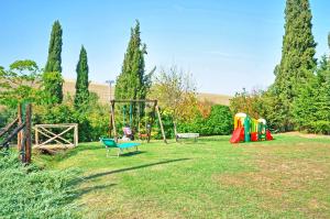 a park with a playground and a swing at Villa Castiglione by PosarelliVillas in Contignano