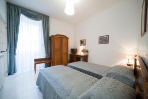 En eller flere senge i et værelse på B&B Porta di Mare