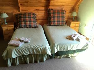 מיטה או מיטות בחדר ב-Marigold's 37 Critchley Common