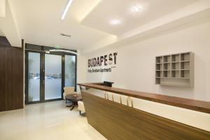 a lobby with a bar in a dental office at Paulay Downtown Apartments in Budapest